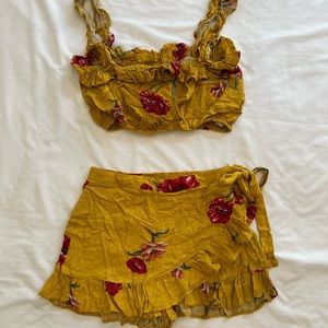 Mustard yellow floral chiffon mini skort set with tie waist and ruffle crop top
